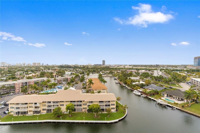 drone / aerial view featuring a water view and a view of city