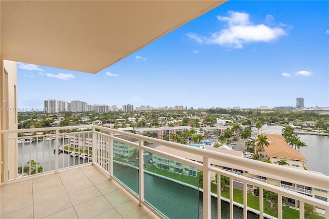 balcony with a water view and a city view