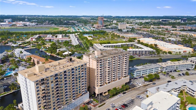 drone / aerial view featuring a water view and a city view