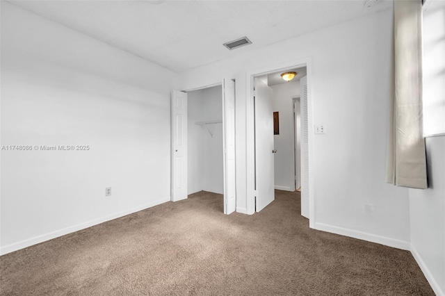 18224 Mediterranean Blvd Unit 5-17, Hialeah, FL 33015 - unfurnished bedroom with carpet flooring, baseboards, visible vents, and a closet