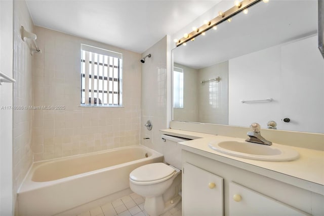 18224 Mediterranean Blvd Unit 5-17, Hialeah, FL 33015 - full bathroom featuring washtub / shower combination, tile patterned flooring, vanity, and toilet