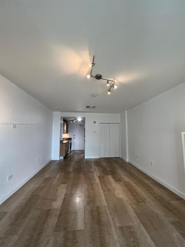 10275 Collins Ave Unit 111, Bal Harbour, FL 33154 - unfurnished living room featuring dark hardwood / wood-style flooring