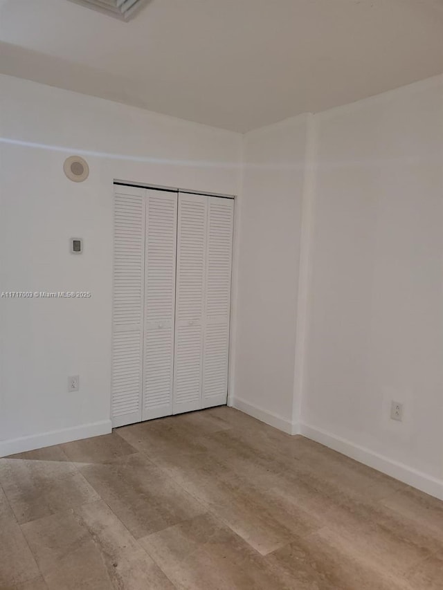 10275 Collins Ave Unit 111, Bal Harbour, FL 33154 - unfurnished bedroom with a closet