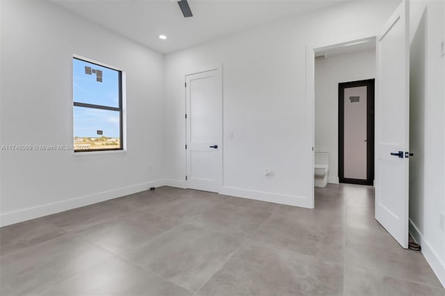 empty room with recessed lighting, a ceiling fan, and baseboards