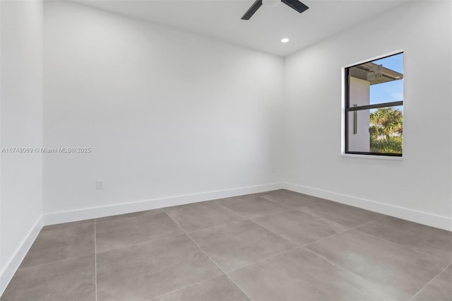 spare room with a ceiling fan, recessed lighting, and baseboards