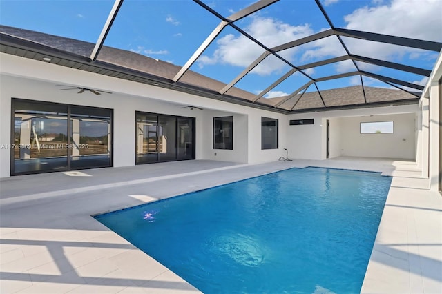 pool with a lanai, ceiling fan, and a patio