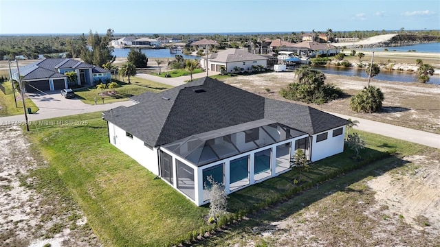 aerial view with a water view and a residential view