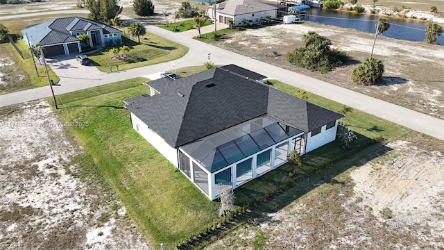 drone / aerial view with a water view