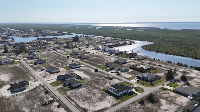 aerial view with a residential view and a water view