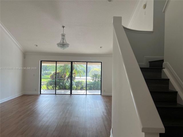8639 Eagle Run Dr Unit 11, Boca Raton, FL 33434 - unfurnished living room featuring ornamental molding, dark wood-style flooring, baseboards, and stairway