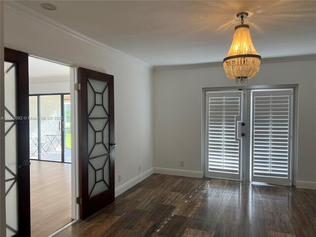 8639 Eagle Run Dr Unit 11, Boca Raton, FL 33434 - unfurnished room with crown molding, wood finished floors, and baseboards