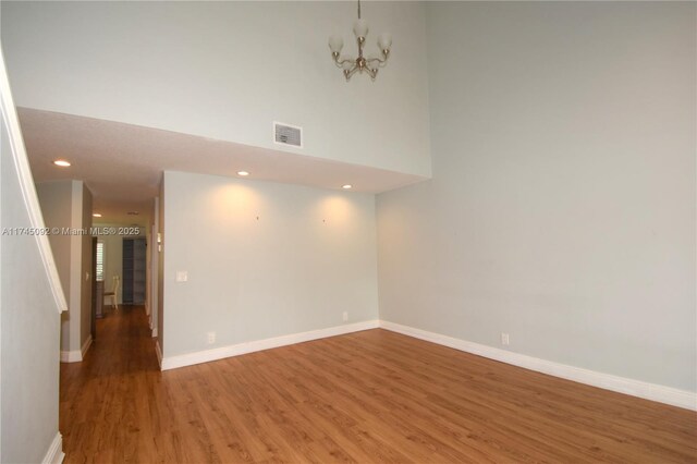8639 Eagle Run Dr Unit 11, Boca Raton, FL 33434 - empty room featuring light wood-style floors, a chandelier, baseboards, and recessed lighting