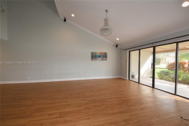 8639 Eagle Run Dr Unit 11, Boca Raton, FL 33434 - empty room featuring lofted ceiling, light wood-style flooring, baseboards, crown molding, and recessed lighting