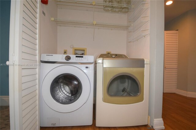8639 Eagle Run Dr Unit 11, Boca Raton, FL 33434 - laundry room with independent washer and dryer, wood finished floors, recessed lighting, and baseboards