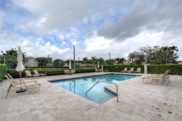 8639 Eagle Run Dr Unit 11, Boca Raton, FL 33434 - community pool with a patio