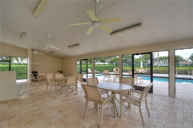 8639 Eagle Run Dr Unit 11, Boca Raton, FL 33434 - dining space featuring vaulted ceiling and ceiling fan