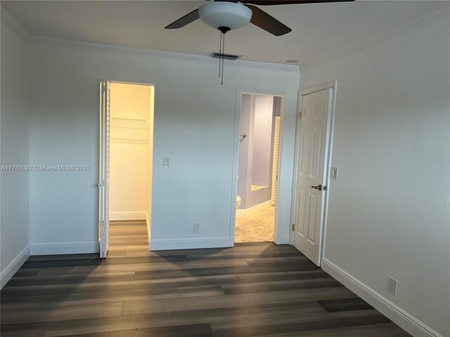 8639 Eagle Run Dr Unit 11, Boca Raton, FL 33434 - unfurnished bedroom with crown molding, dark wood finished floors, baseboards, a closet, and a ceiling fan