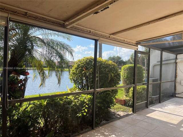 8639 Eagle Run Dr Unit 11, Boca Raton, FL 33434 - unfurnished sunroom with a water view