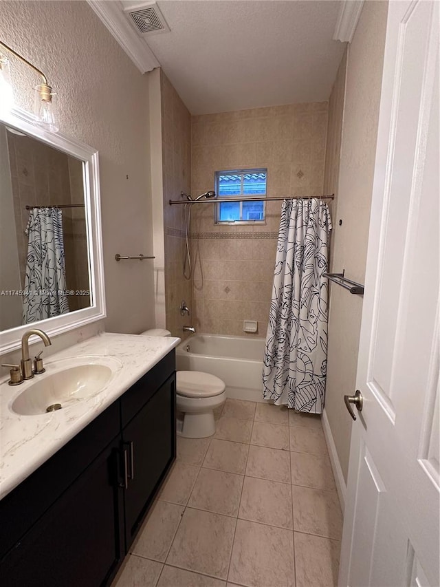 full bathroom with shower / bath combo, tile patterned flooring, toilet, a textured ceiling, and vanity