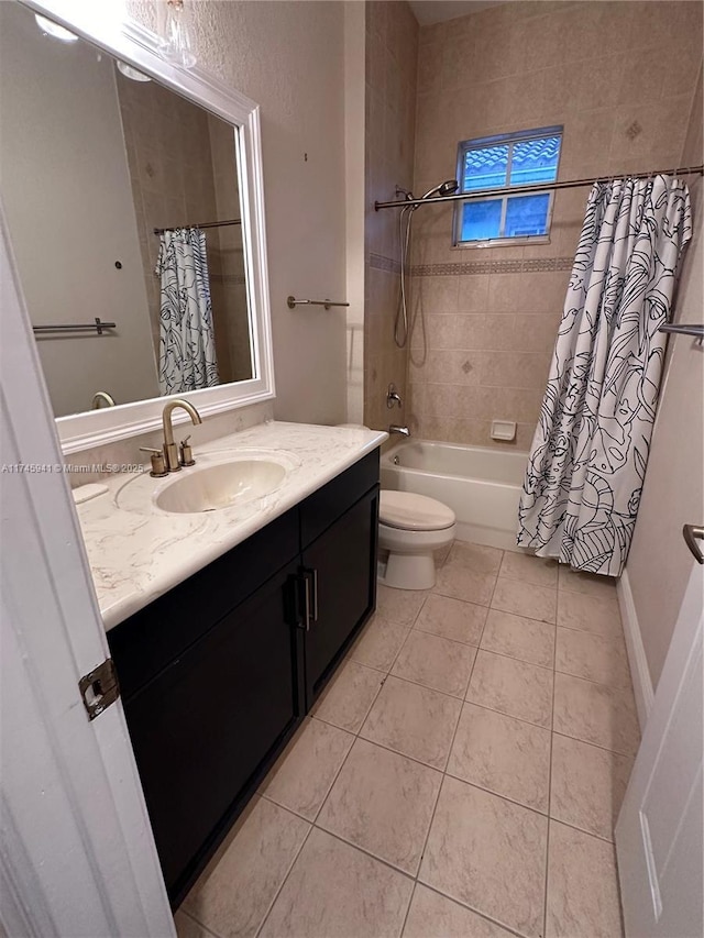 full bathroom with shower / tub combo with curtain, vanity, toilet, and tile patterned floors