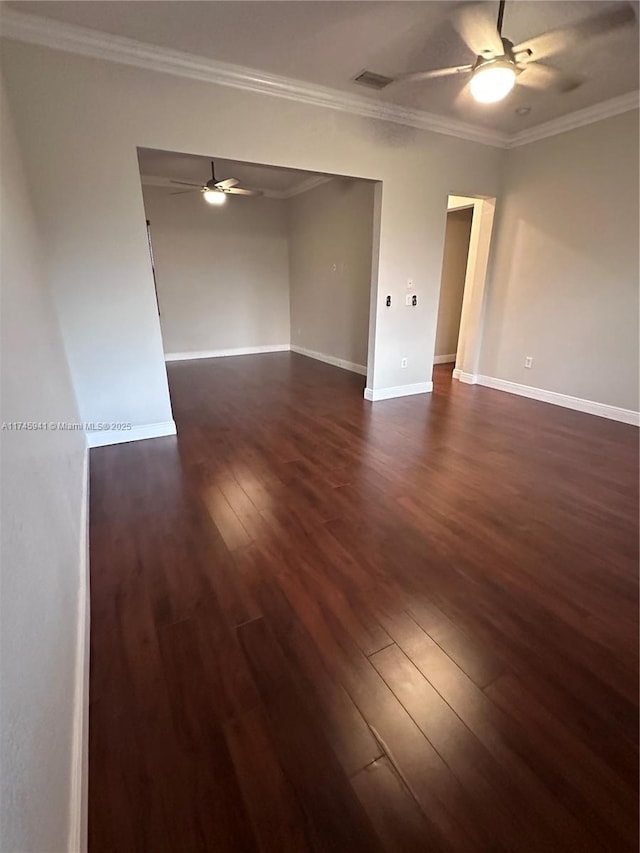 empty room with ceiling fan, crown molding, and dark hardwood / wood-style flooring