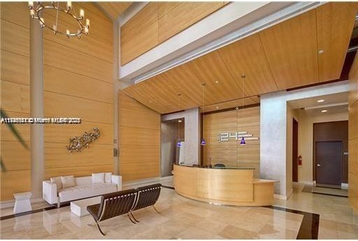 reception area featuring a chandelier