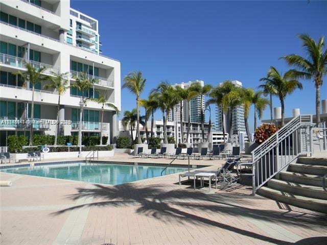 view of swimming pool with a patio area