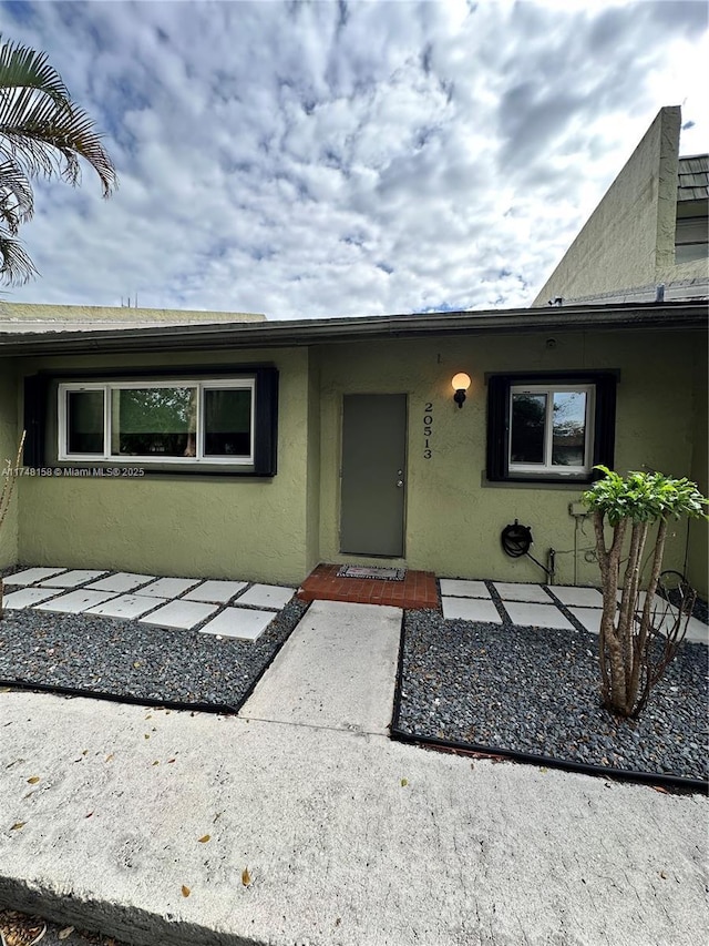 property entrance with a patio area