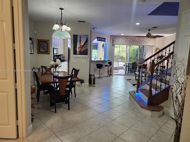 dining room with light tile patterned flooring and ceiling fan