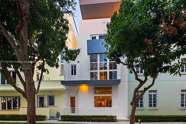 view of outdoor building at dusk