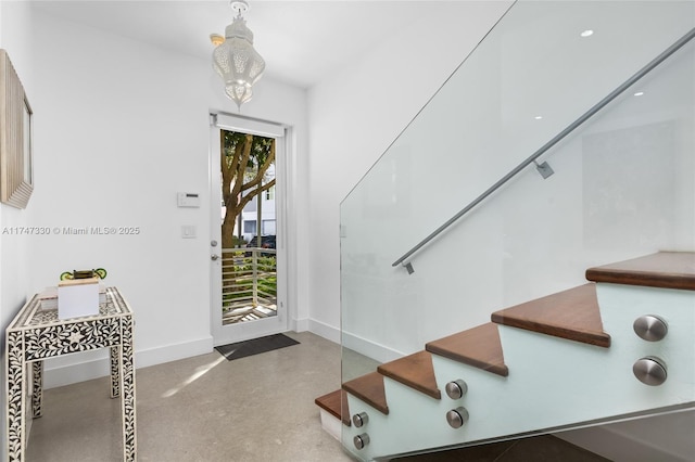211 Water Way Unit 211, Miami Beach, FL 33141 - foyer entrance featuring baseboards, a healthy amount of sunlight, and stairs