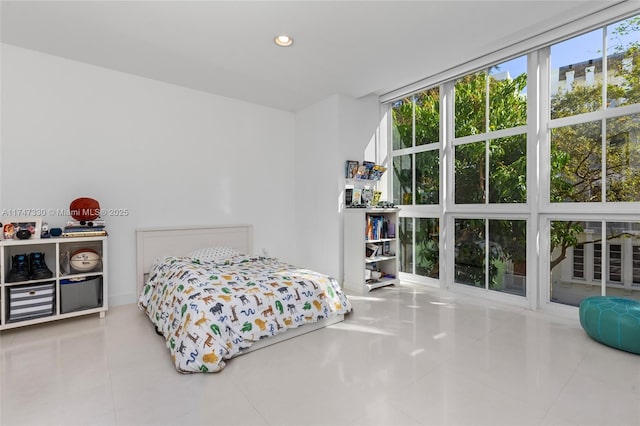 211 Water Way Unit 211, Miami Beach, FL 33141 - bedroom featuring tile patterned flooring, multiple windows, expansive windows, and recessed lighting
