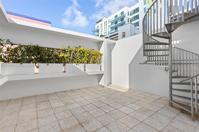 211 Water Way Unit 211, Miami Beach, FL 33141 - view of patio / terrace featuring stairs