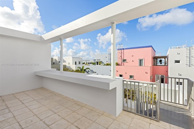 211 Water Way Unit 211, Miami Beach, FL 33141 - view of patio featuring a balcony and a residential view
