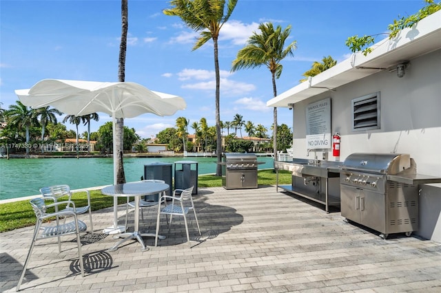 211 Water Way Unit 211, Miami Beach, FL 33141 - wooden terrace featuring a grill, a water view, a patio area, and a sink