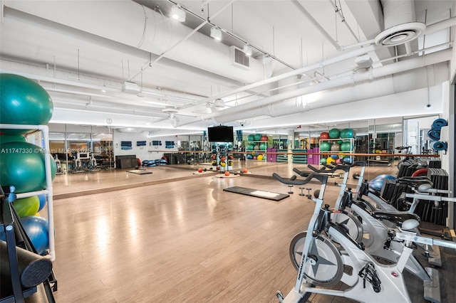 211 Water Way Unit 211, Miami Beach, FL 33141 - workout area featuring visible vents and wood finished floors