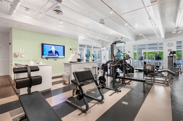 211 Water Way Unit 211, Miami Beach, FL 33141 - gym featuring baseboards, visible vents, and track lighting