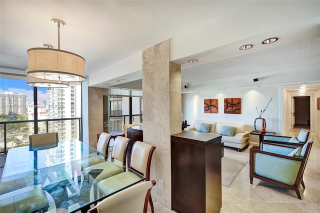 dining room featuring light tile patterned floors and a city view