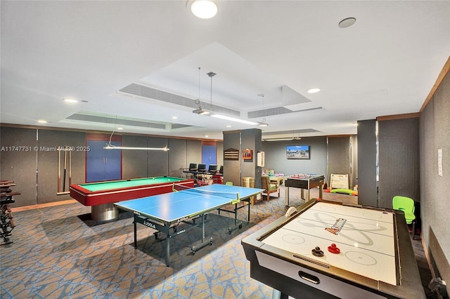 rec room with pool table, a tray ceiling, and baseboards