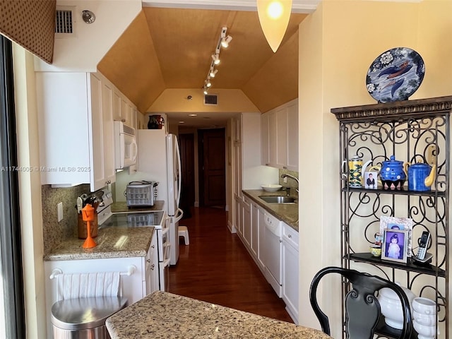 kitchen with white cabinetry, sink, white appliances, light stone counters, and decorative backsplash