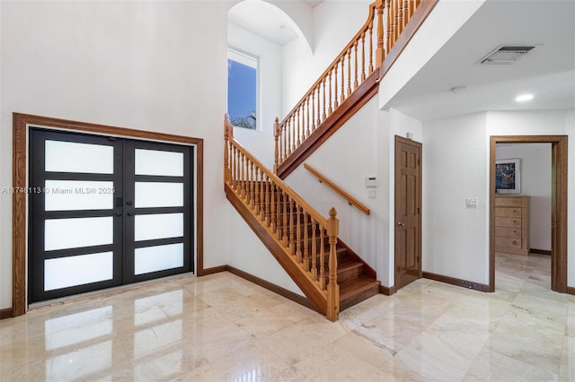 kitchen featuring a center island, open floor plan, a healthy amount of sunlight, and stainless steel dishwasher