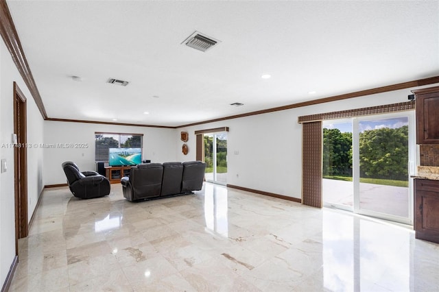 kitchen with a sink, visible vents, marble finish floor, appliances with stainless steel finishes, and a center island