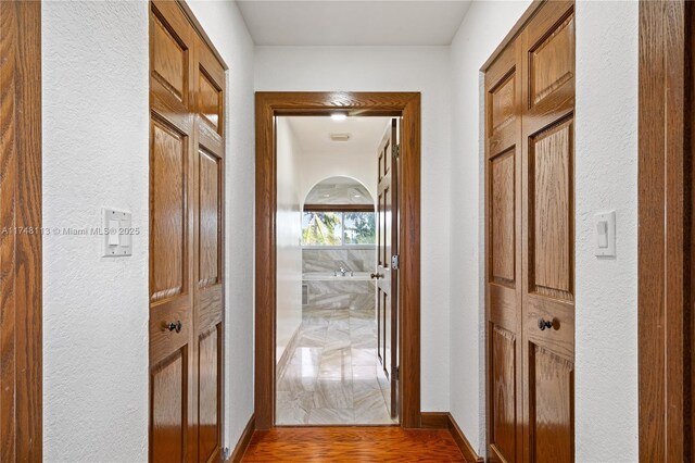 bedroom with recessed lighting, wood finished floors, and baseboards