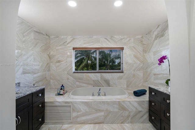 bedroom with wood finished floors, visible vents, and baseboards