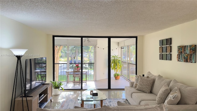 living area featuring a wall of windows and a textured ceiling