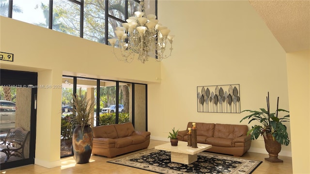 living room featuring tile patterned flooring, a textured ceiling, and a towering ceiling