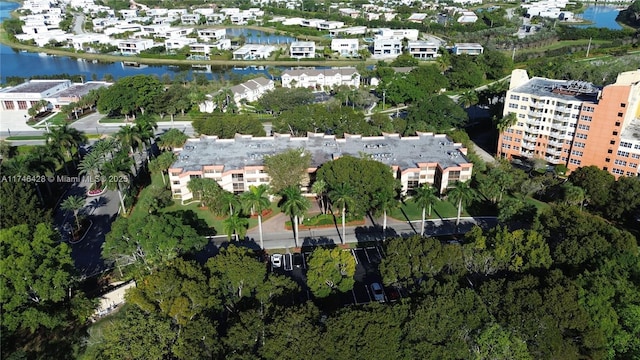 bird's eye view featuring a residential view and a water view