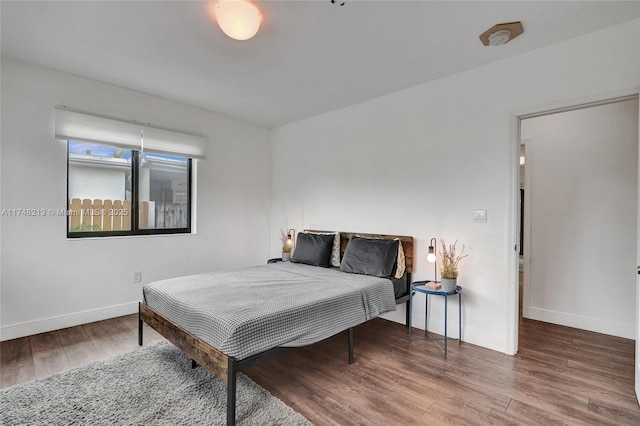 bedroom featuring hardwood / wood-style floors