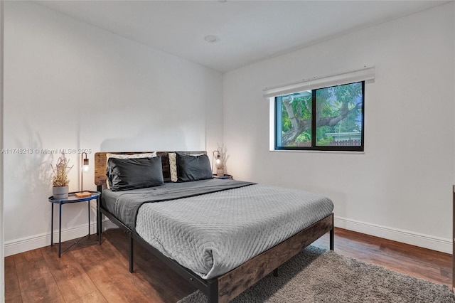 bedroom featuring dark hardwood / wood-style floors