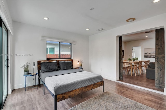 bedroom featuring hardwood / wood-style floors